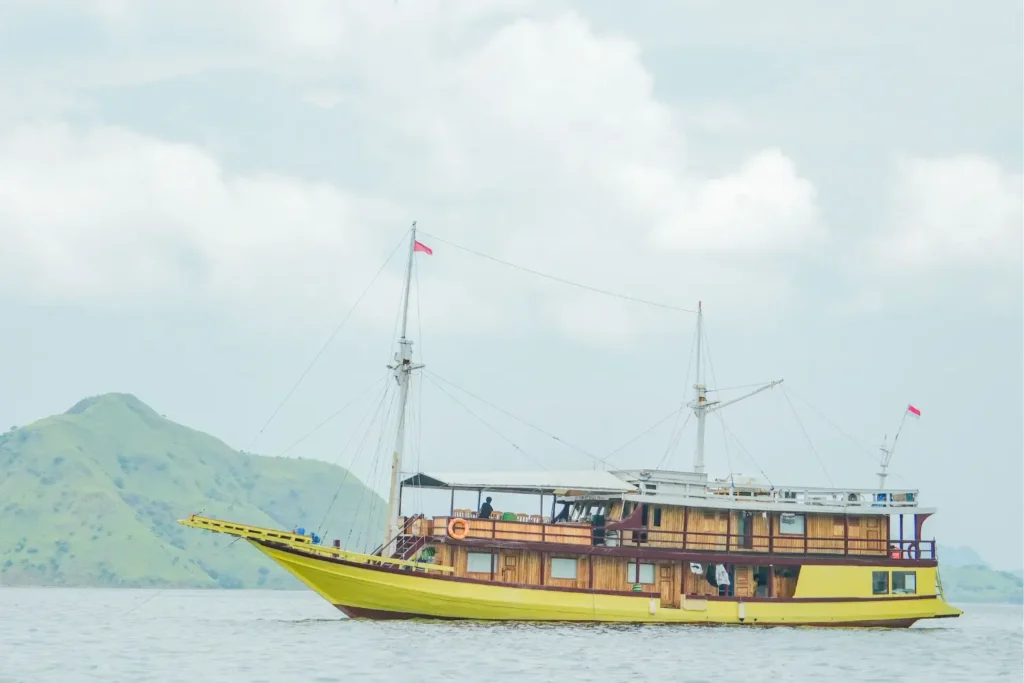 Hatira Hela deluxe phinisi charter boat departing Labuan Bajo