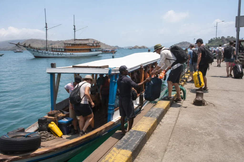 Guests boarding a tender at Labuan Bajo harbour on departure morning